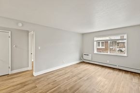 Denver apartment for rent - A room with a window and a door.