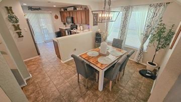 Killeen house for rent - A dining room with a table set for two and a kitchen area in the background.