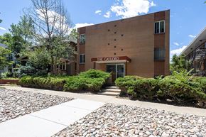 Denver apartment for rent - The Gaylorord building is made of brick and has a red sign on the front.