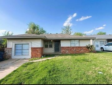 Oklahoma City house for rent - A house with a white car parked in front.