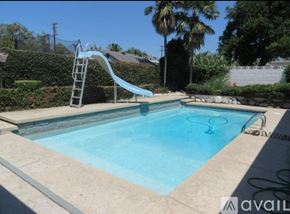 Chino house for rent - A small pool with a slide in the backyard.