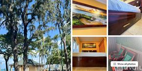 Honolulu apartment for rent - A bedroom with a large bed and a ceiling fan.