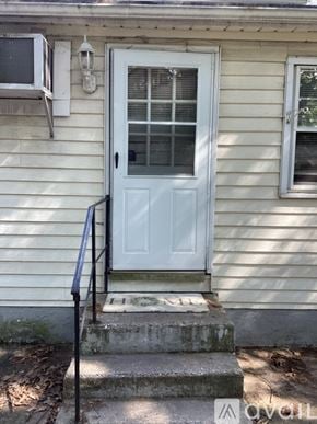 Pennsauken apartment for rent - A white door with a glass window is on the front of a house.