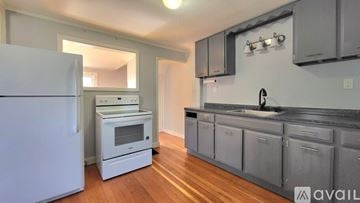 Sanford apartment for rent - A kitchen with a white refrigerator and a white oven.