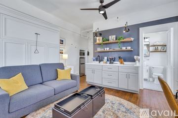 Savannah apartment for rent - A living room with a grey sofa and a coffee table.