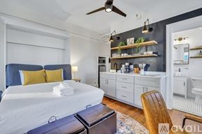 Savannah apartment for rent - A bedroom with a large bed and a ceiling fan.