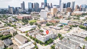 Houston apartment for rent - A cityscape with a red pin on a building in the foreground.