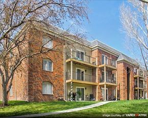 Lincoln apartment for rent - a brick building with a tree in front of it