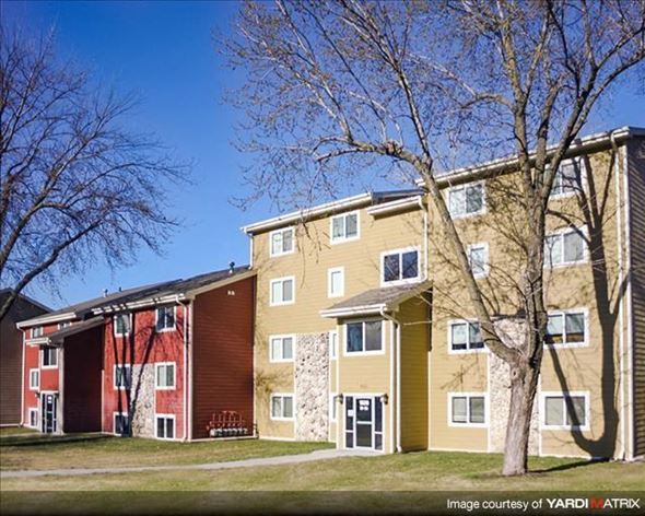 Council Bluffs apartment for rent - an apartment building with a tree in front of it