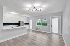 Bay Harbor apartment for rent - A spacious kitchen with wooden floors and a large island.