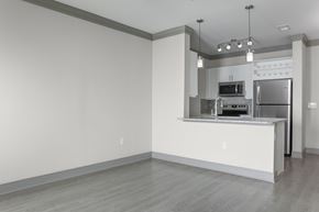 Overland Park apartment for rent - A kitchen with a white counter and stainless steel appliances.