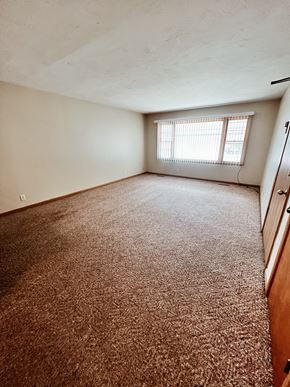 Lincoln apartment for rent - an empty room with carpet and a window