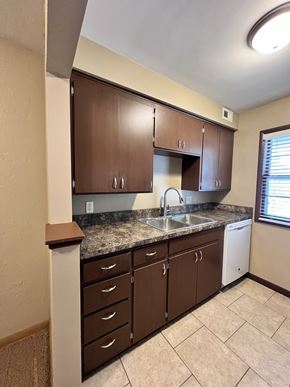 Lincoln apartment for rent - an empty kitchen with a sink and counter top