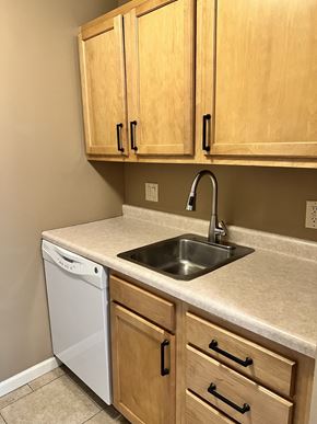 Lincoln apartment for rent - an empty kitchen with a sink and a dishwasher