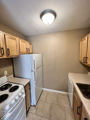 Lincoln apartment for rent - an empty kitchen with a stove refrigerator and sink