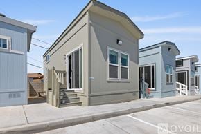 Barstow apartment for rent - A row of small, modern houses with grey exteriors and white trim.
