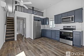 Barstow apartment for rent - A modern kitchen with dark wood cabinets and stainless steel appliances.