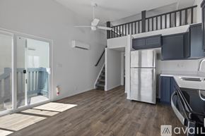 Barstow apartment for rent - A staircase with a carpeted runner and wooden balusters.