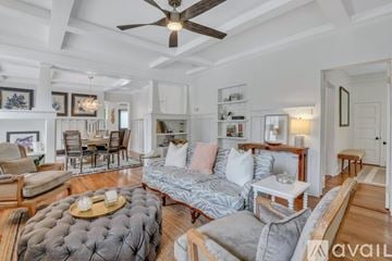 Savannah house for rent - A living room with a grey sofa and a wooden coffee table.