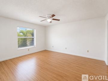 Cape Coral apartment for rent - A kitchen with white appliances and wooden cabinets.
