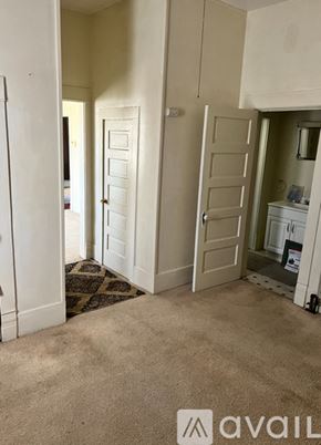 Amarillo house for rent - A carpeted room with a door and a cabinet.