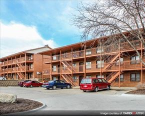 Lincoln apartment for rent - a building with cars parked in front of it