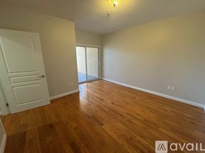 Los Angeles apartment for rent - A room with wooden flooring and a white door.