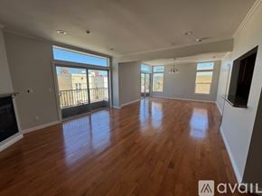 Los Angeles apartment for rent - A spacious living room with hardwood floors and large windows.