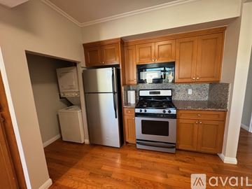 Los Angeles apartment for rent - A kitchen with wooden cabinets and a granite countertop.