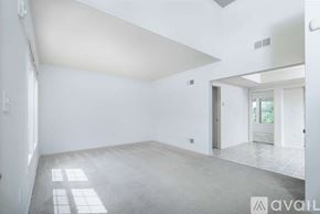 Mountville townhouse for rent - A spacious room with a tiled floor and a skylight.