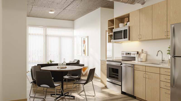 Denver apartment for rent - A kitchen with a table and chairs in front of a window.