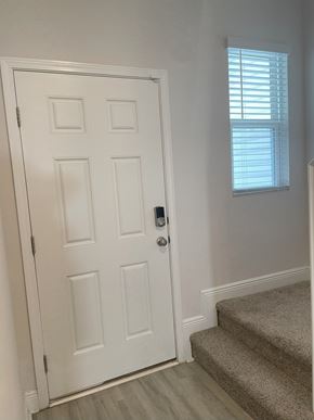 Pensacola townhouse for rent - A white door with a window above it.