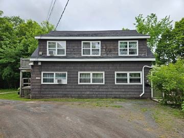 New Glasgow apartment for rent - A two-story house with a grey exterior and white trim.