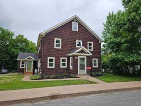 New Glasgow apartment for rent - A red house with a white door and windows.
