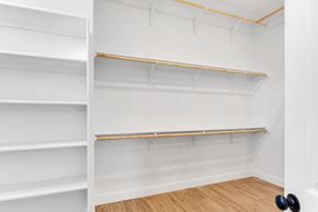 Horseshoe Bay house for rent - A white closet with shelves and a black door knob.