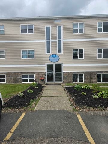 Stellarton apartment for rent - The entrance to a building with a blue sign that says "CD".