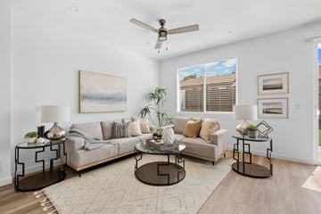 Spring Valley apartment for rent - A living room with a grey couch, a coffee table, and a painting on the wall.