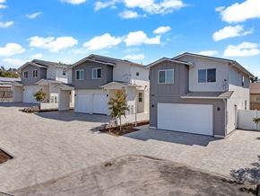 Spring Valley apartment for rent - A row of houses with garages and driveways.