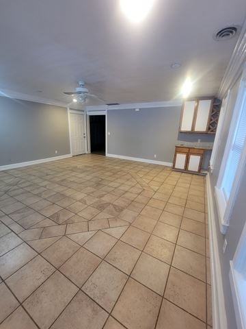 Post Falls house for rent - A room with a tile floor and a ceiling fan.