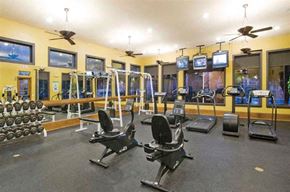Austin apartment for rent - A gym with a variety of equipment including treadmills, weights, and exercise machines.