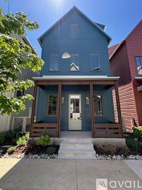 Oklahoma City house for rent - A blue house with a white door and windows.