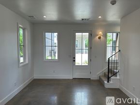 Oklahoma City house for rent - A spacious room with a staircase leading to the second floor.