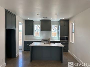 Oklahoma City house for rent - A kitchen with a large island in the middle.