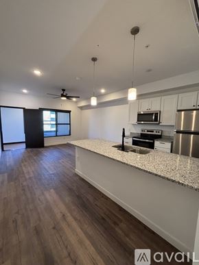 Madison apartment for rent - A kitchen with a bar area and a refrigerator.
