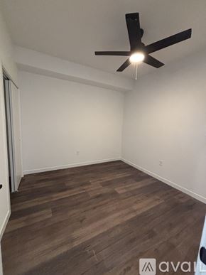 Madison apartment for rent - A small apartment with a green couch and a white table.