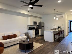 Madison apartment for rent - A line of modern townhouses with a grassy area in front.