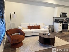 Madison apartment for rent - A modern apartment building with balconies and doors is shown.