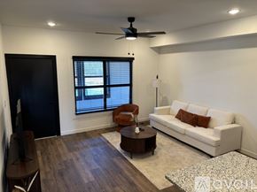 Madison apartment for rent - A kitchen with a bar area and a refrigerator.