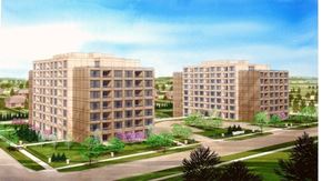 Oshawa apartment for rent - Two identical buildings are surrounded by a green lawn.