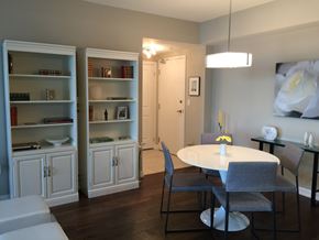 Oshawa apartment for rent - A dining room with a white table and grey chairs.